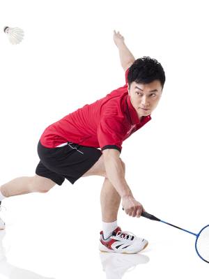 Male Chinese athlete playing badminton